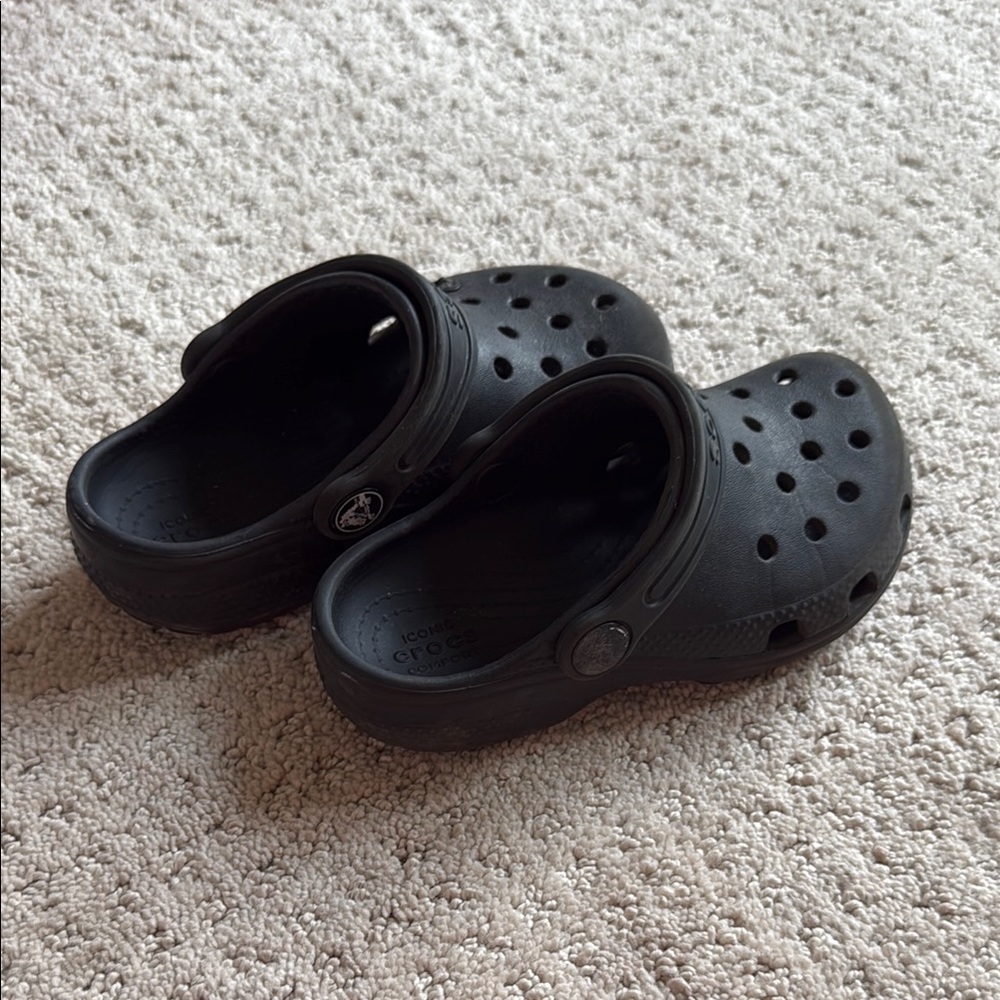 CROCS Black Slip-ons with Perforated Design and Croslite Material